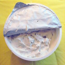 Package of a soy-based cream cheese alternative with chives