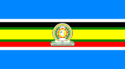 Nine horizontal strips coloured (from top to bottom): blue, white, black, green, yellow, green, red, white, then blue. The emblem of the EAC is placed in the centre.