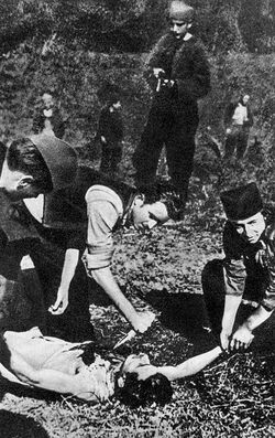 Chetniks in Šumadija kill a Partisan through heart extraction.jpg