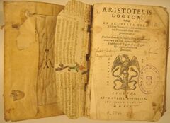 Front cover of book, titled "Aristotelis Logica", with an illustration of eagle on a snake