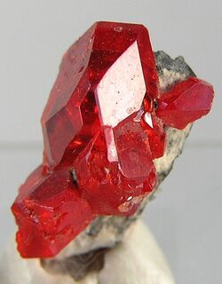 a cluster of bright cherry-red crystals