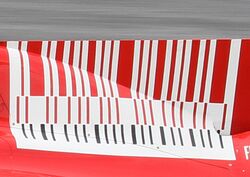 Red-and-white barcode on a race car