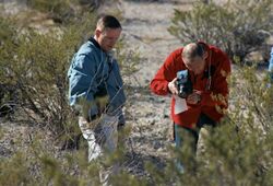 Aldrin and Armstrong performing geological training in desert