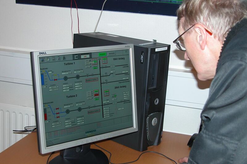 File:Man with computer, controlling a hydroelectric power plant.JPG