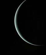 Departing image of crescent Uranus