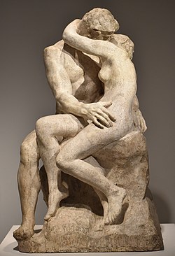 A marble rendition of Rodin's Le Baiser (The Kiss); two figures embraced in a kiss