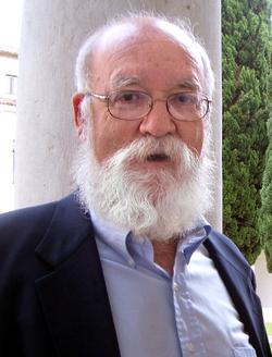 Dennett wearing a button-up shirt and a jacket
