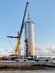 Crane hooking onto a steel vessel body