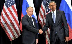 Photo of Obama shaking hands with Vladimir Putin in front of Russian and American flags