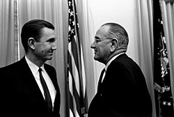 President Lyndon B. Johnson and Attorney General Ramsey Clark shaking hands.